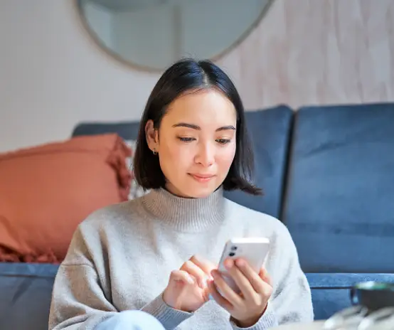 Smiling Asian Woman at Home using gigit Mobile application